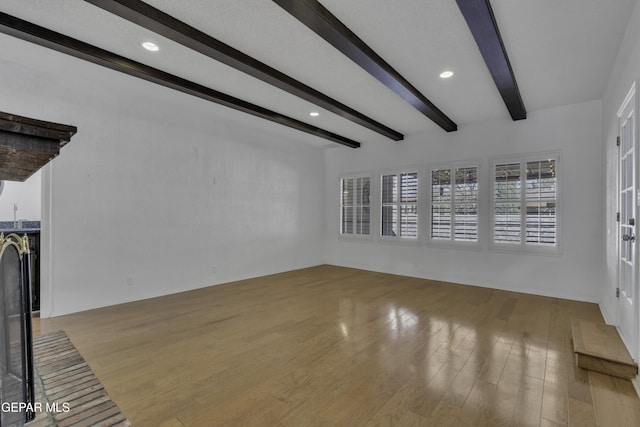 4945 Vista Grande Cir, El Paso, TX 79922 - unfurnished living room with wood finished floors, recessed lighting, and beamed ceiling