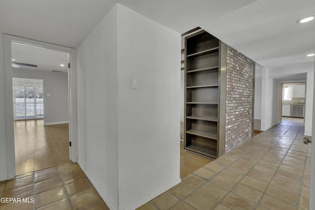 4945 Vista Grande Cir, El Paso, TX 79922 - hallway with baseboards, built in features, recessed lighting, and a textured ceiling
