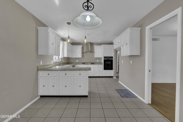 4945 Vista Grande Cir, El Paso, TX 79922 - kitchen featuring visible vents, cooktop, white cabinetry, wall chimney range hood, and light tile patterned floors