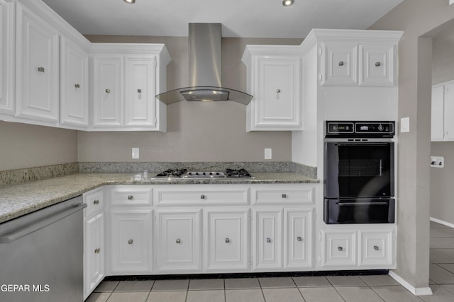 4945 Vista Grande Cir, El Paso, TX 79922 - kitchen with wall chimney range hood, white cabinetry, a warming drawer, and appliances with stainless steel finishes