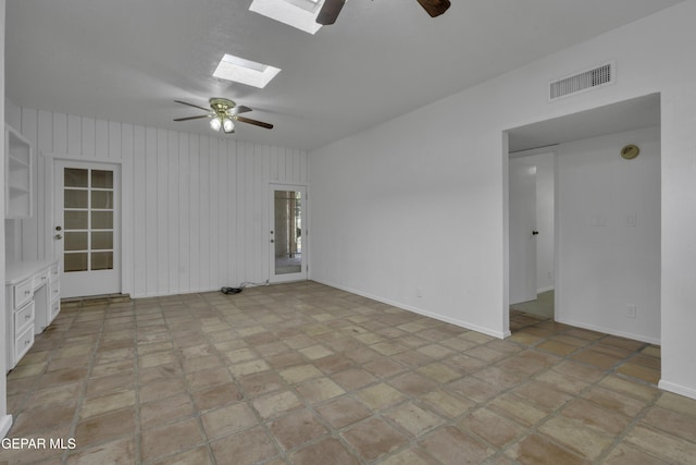4945 Vista Grande Cir, El Paso, TX 79922 - spare room featuring baseboards, ceiling fan, visible vents, and a skylight
