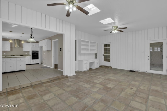 4945 Vista Grande Cir, El Paso, TX 79922 - unfurnished living room with a skylight and ceiling fan