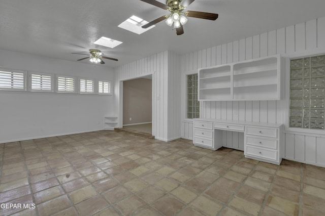 4945 Vista Grande Cir, El Paso, TX 79922 - interior space with a skylight, baseboards, ceiling fan, and built in study area