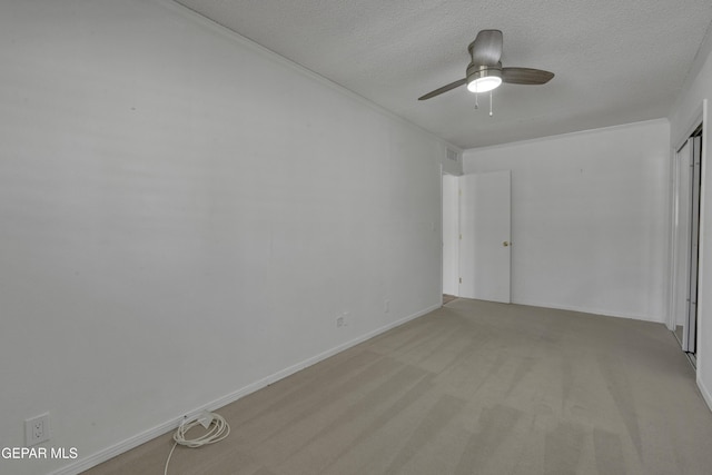 4945 Vista Grande Cir, El Paso, TX 79922 - unfurnished bedroom featuring carpet, baseboards, a textured ceiling, a ceiling fan, and a closet