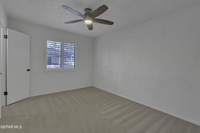 4945 Vista Grande Cir, El Paso, TX 79922 - empty room featuring light carpet, baseboards, ceiling fan, and a textured ceiling