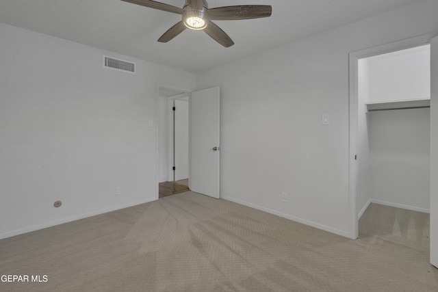 4945 Vista Grande Cir, El Paso, TX 79922 - unfurnished bedroom featuring baseboards, visible vents, a walk in closet, and carpet