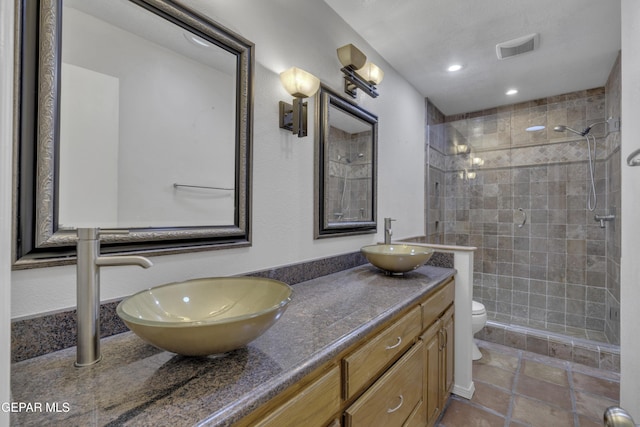4945 Vista Grande Cir, El Paso, TX 79922 - full bath with visible vents, a sink, toilet, and a shower stall