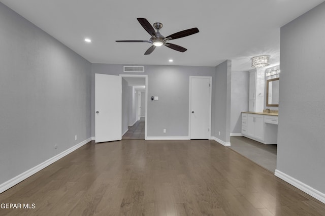 4945 Vista Grande Cir, El Paso, TX 79922 - unfurnished bedroom with wood finished floors, ensuite bathroom, baseboards, visible vents, and recessed lighting
