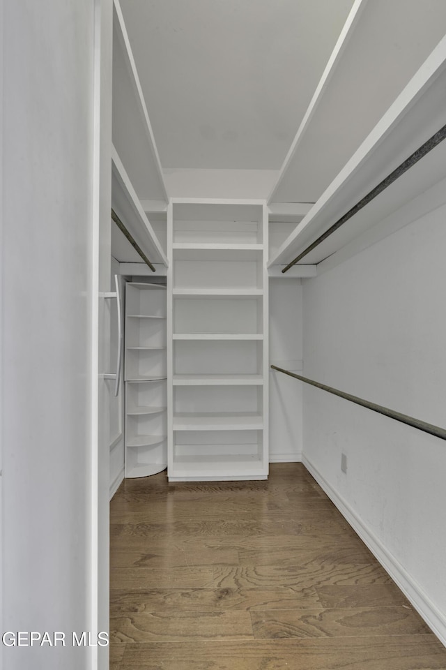 4945 Vista Grande Cir, El Paso, TX 79922 - walk in closet with wood finished floors
