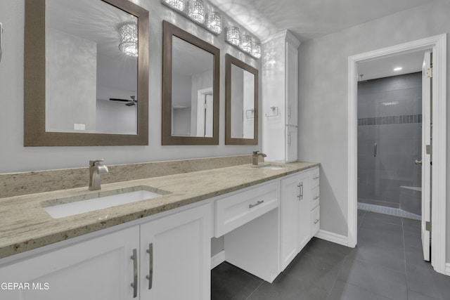 4945 Vista Grande Cir, El Paso, TX 79922 - bathroom with double vanity, a sink, tile patterned flooring, and a shower stall
