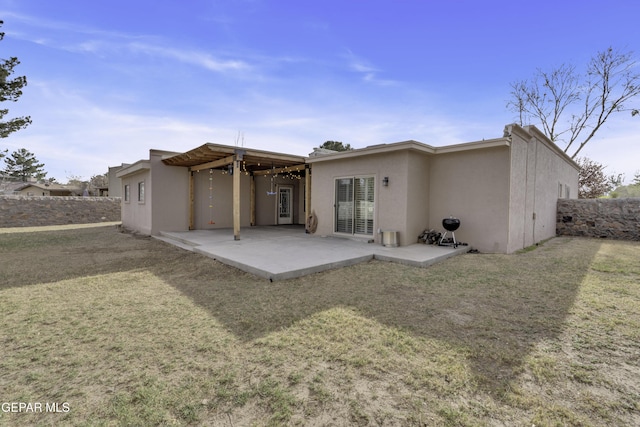 4945 Vista Grande Cir, El Paso, TX 79922 - rear view of house with a lawn, stucco siding, fence, and a patio