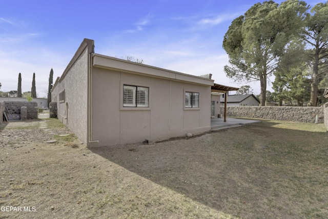 4945 Vista Grande Cir, El Paso, TX 79922 - back of house featuring stucco siding, fence, and a patio