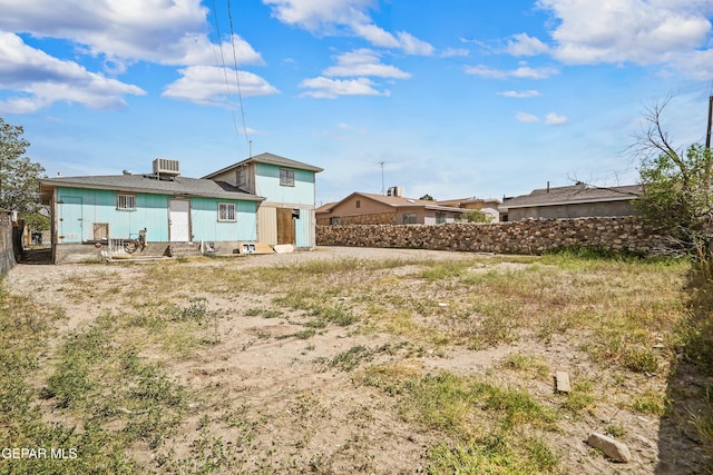 9005 Electra Dr, Canutillo, TX 79835 - back of property featuring central AC unit and fence