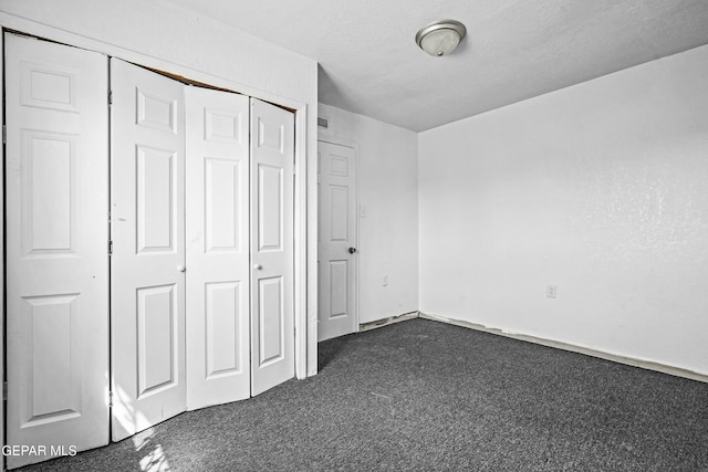9005 Electra Dr, Canutillo, TX 79835 - unfurnished bedroom with a closet and dark carpet