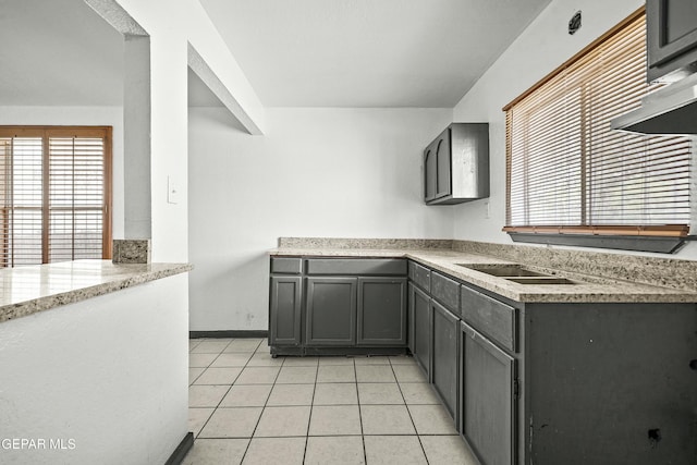 9005 Electra Dr, Canutillo, TX 79835 - kitchen with light tile patterned floors, wall chimney range hood, gray cabinets, light countertops, and baseboards
