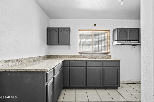 9005 Electra Dr, Canutillo, TX 79835 - kitchen with a sink, light tile patterned floors, light countertops, and gray cabinetry