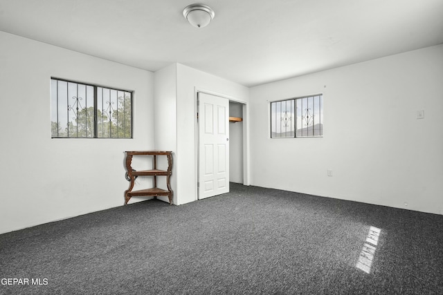 9005 Electra Dr, Canutillo, TX 79835 - unfurnished bedroom with a closet, carpet flooring, and multiple windows