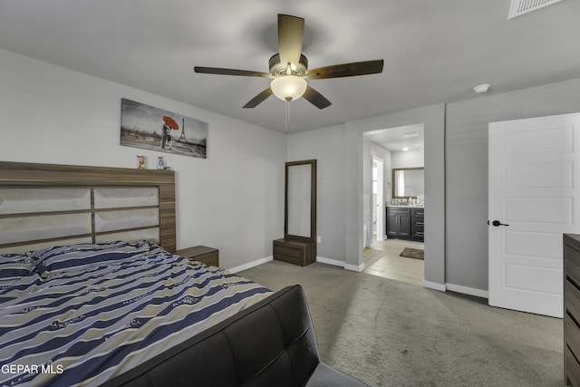 221 Ilchester Way, El Paso, TX 79928 - carpeted bedroom with connected bathroom, baseboards, ceiling fan, and visible vents