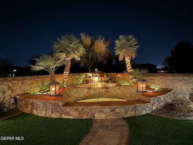 view of yard at twilight