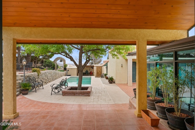 pool featuring a fenced backyard and a patio