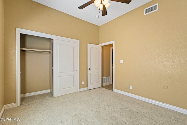 unfurnished bedroom featuring baseboards, visible vents, and carpet