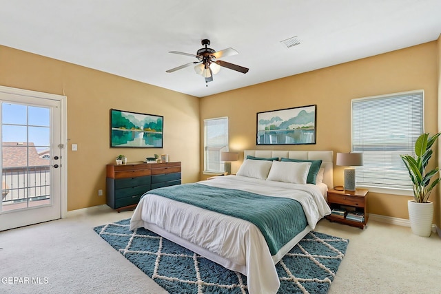 bedroom with carpet, baseboards, access to outside, ceiling fan, and visible vents