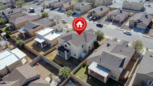 birds eye view of property with a residential view