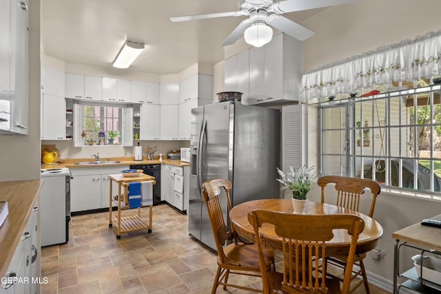kitchen featuring dishwasher, ceiling fan, a sink, stainless steel refrigerator with ice dispenser, and stove