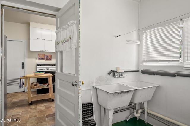 bathroom featuring stone finish floor