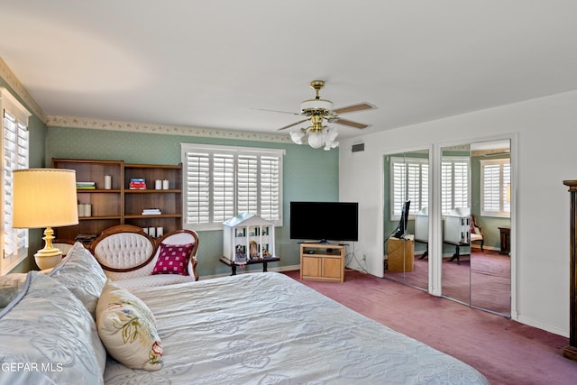 bedroom with baseboards, carpet floors, ceiling fan, and visible vents