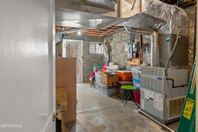 basement with heating unit and electric panel