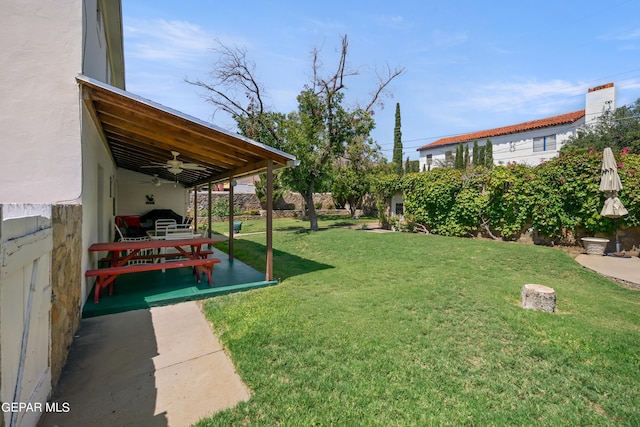 view of yard with a patio and a ceiling fan