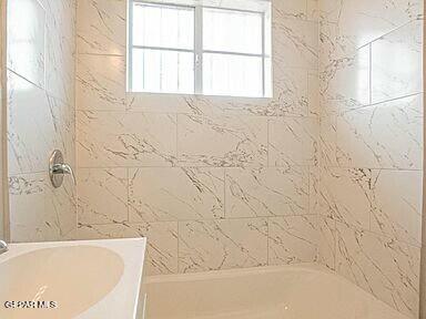 8718 Lawson St Unit 9, El Paso, TX 79904 - bathroom with shower / bathing tub combination