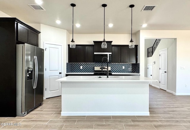 14617 Tierra Nectar Ave, El Paso, TX 79938 - kitchen with appliances with stainless steel finishes, wood tiled floor, and visible vents