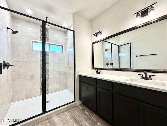 14617 Tierra Nectar Ave, El Paso, TX 79938 - full bathroom with double vanity, a sink, and a stall shower