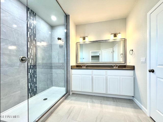 14613 Tierra Nectar Ave, El Paso, TX 79938 - full bathroom featuring a sink, a walk in shower, baseboards, and double vanity
