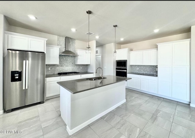 14613 Tierra Nectar Ave, El Paso, TX 79938 - kitchen featuring decorative backsplash, dark countertops, a sink, stainless steel appliances, and wall chimney exhaust hood