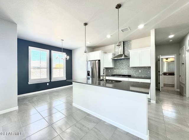 14613 Tierra Nectar Ave, El Paso, TX 79938 - kitchen featuring wall chimney range hood, dark countertops, tasteful backsplash, a sink, and stainless steel fridge with ice dispenser