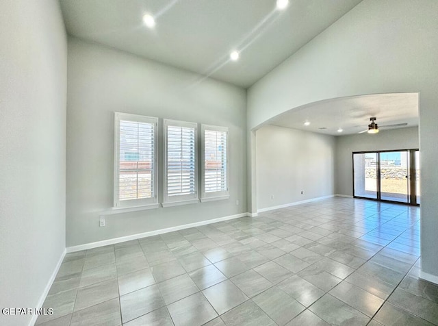 14613 Tierra Nectar Ave, El Paso, TX 79938 - tiled spare room featuring a ceiling fan, arched walkways, high vaulted ceiling, baseboards, and recessed lighting