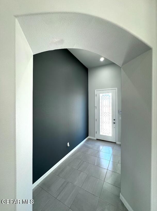14613 Tierra Nectar Ave, El Paso, TX 79938 - foyer featuring arched walkways, baseboards, and tile patterned flooring