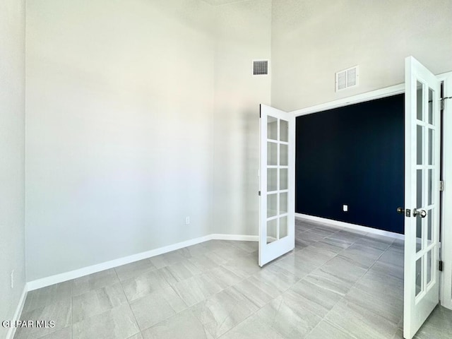 14613 Tierra Nectar Ave, El Paso, TX 79938 - tiled spare room with french doors, baseboards, a high ceiling, and visible vents