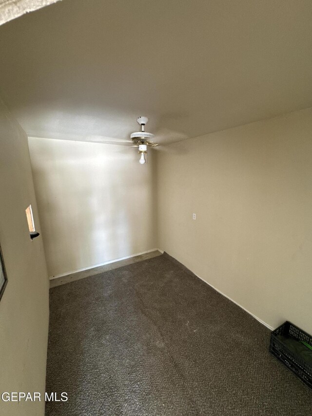 121 Compa Dr, Tornillo, TX 79853 - empty room with a ceiling fan and dark colored carpet