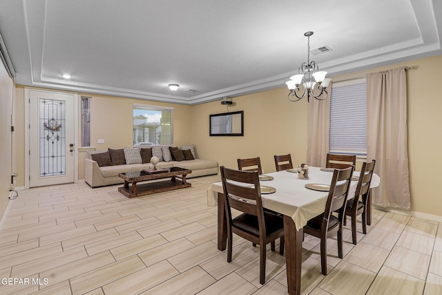 14717 Tierra Escape Ave, El Paso, TX 79938 - dining space featuring a chandelier, baseboards, and a tray ceiling