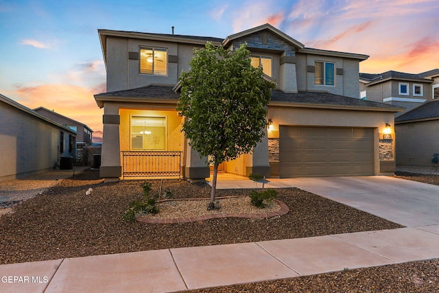14717 Tierra Escape Ave, El Paso, TX 79938 - view of front of house featuring stucco siding, concrete driveway, an attached garage, and central air condition unit