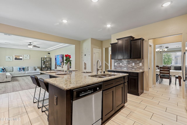 14717 Tierra Escape Ave, El Paso, TX 79938 - kitchen with a sink, dishwasher, open floor plan, a center island with sink, and a kitchen breakfast bar