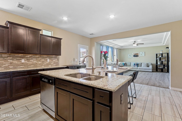 14717 Tierra Escape Ave, El Paso, TX 79938 - kitchen with a sink, stainless steel dishwasher, a kitchen breakfast bar, a center island with sink, and open floor plan