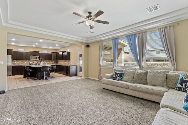 14717 Tierra Escape Ave, El Paso, TX 79938 - living area featuring a tray ceiling, ceiling fan, recessed lighting, and light colored carpet