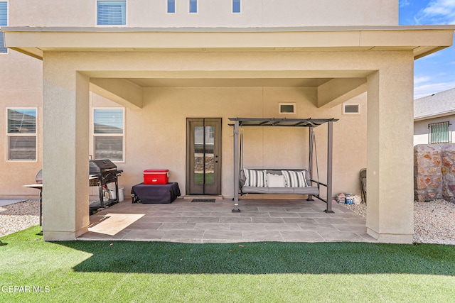 14717 Tierra Escape Ave, El Paso, TX 79938 - rear view of house featuring stucco siding, a patio, and a yard