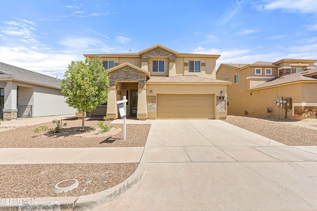 14717 Tierra Escape Ave, El Paso, TX 79938 - view of front of home with stone siding, stucco siding, driveway, and an attached garage