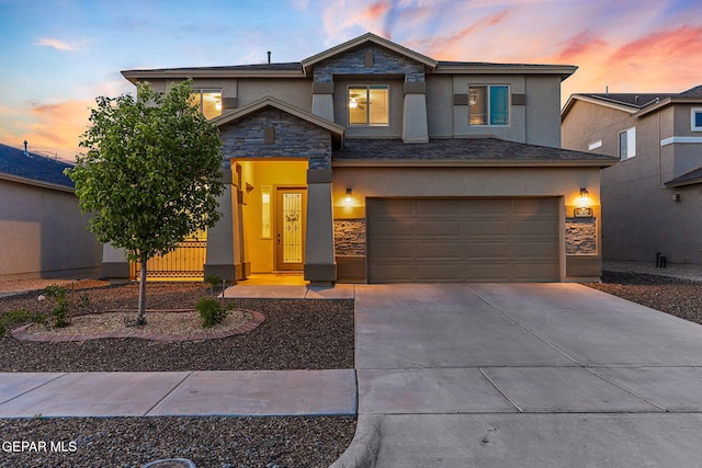 14717 Tierra Escape Ave, El Paso, TX 79938 - view of front of house with stone siding, stucco siding, driveway, and a garage